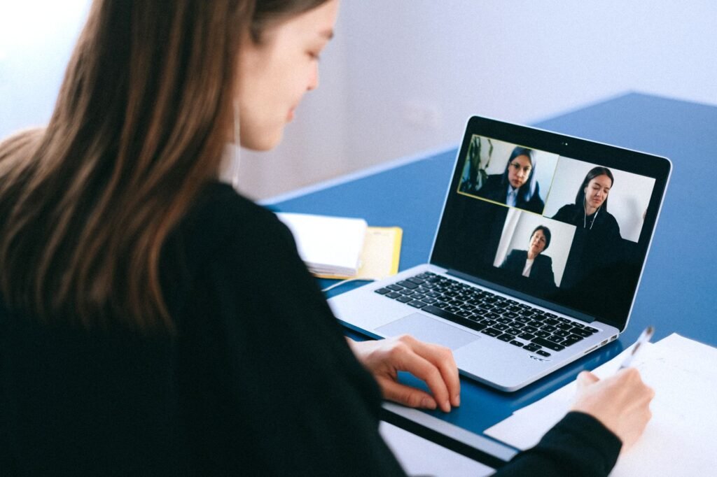 People on a video call using Zoom with AI meeting assistant